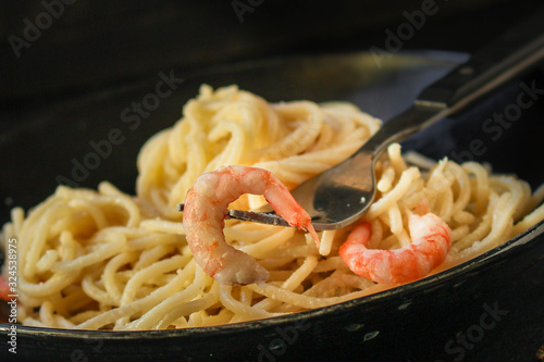pasta prawn (spaghetti shrimp cream sauce and seafood ) menu concept. food background. top view. copy space