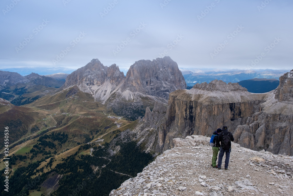 Pair of tourist looking on Italian Dolomite from Sass Pordoi Terrazza Delle Dolomiti