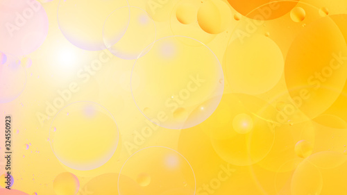 photo, bright oily drops in water with colorful background, close-up
