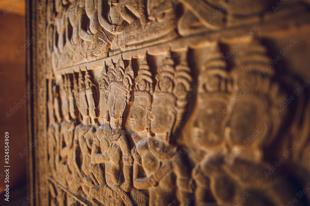 Walls decorated with wall carvings at Angkor Wat Temple. Siem Reap, Cambodia.