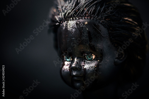 Creepy bloody doll in the dark © Jakub Krechowicz