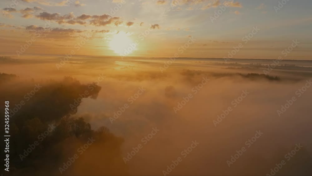 Fog above the ground, lake and forest. A beautiful morning mist enveloped the earth and the lake. Fog above the ground, lake and forest. A beautiful morning mist enveloped the earth and the lake.