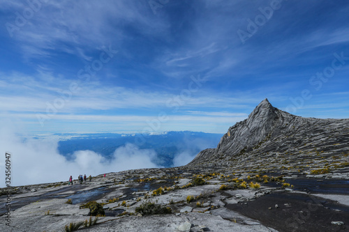 Low's Peak across the South Peak (3,921m) of Mount Kinabalu, Sabah, Malaysia.  Mount Kinabalu or Gunung Kinabalu is the 20th most prominent mountain in the world by topographic prominence.