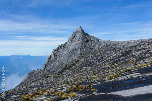 South Peak (3,921m) of Mount Kinabalu, Sabah, Malaysia.  Mount Kinabalu or Gunung Kinabalu is the 20th most prominent mountain in the world by topographic prominence. photo