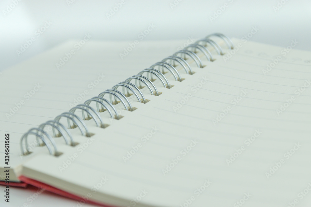 The notebook has lines placed on a white scene. The notebook has lines placed on a white scene.