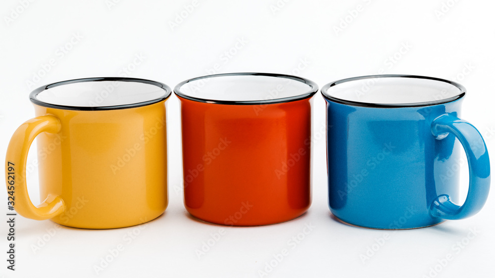 metal mugs on a white isolated background. metal mugs on a white isolated background.
