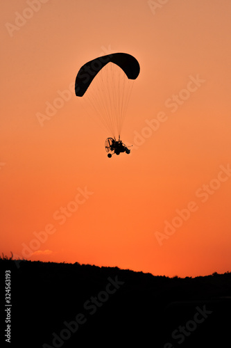 Silhouette of Paramotor at Sunset