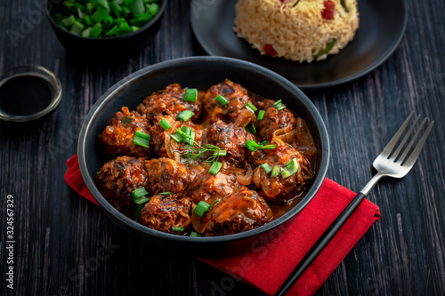 Veg manchurian with a bowl of fried rice  photo
