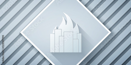 Paper cut Fire in burning buildings on city street icon isolated on grey background. Destroyed city on fire. Paper art style. Vector Illustration