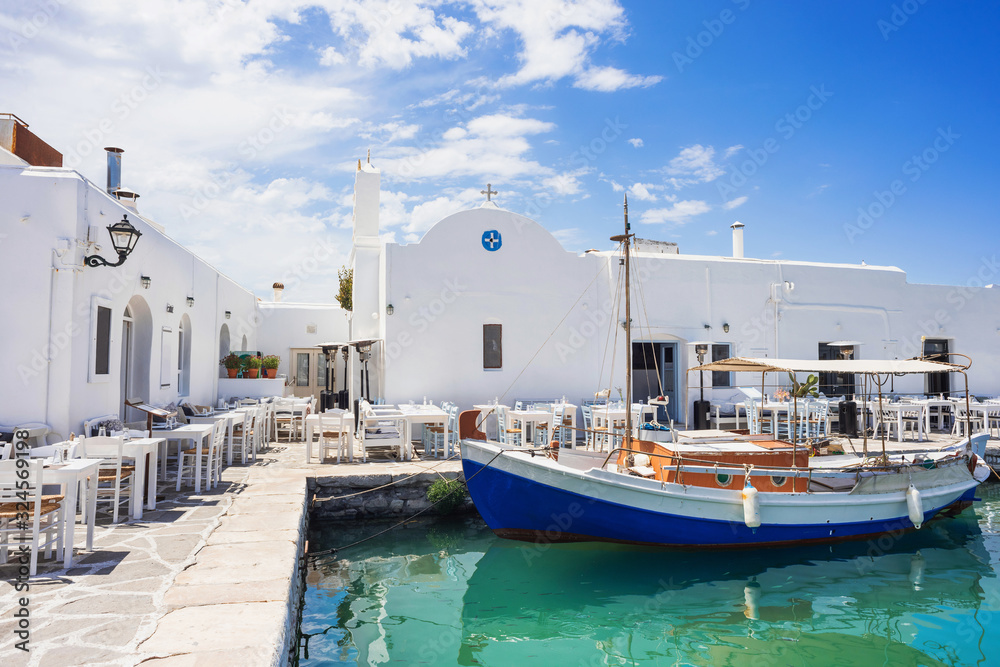 Naousa, Greek fishing village on Paros island, Greece. Outdoor cafes. Popular tourist travel destination in Europe