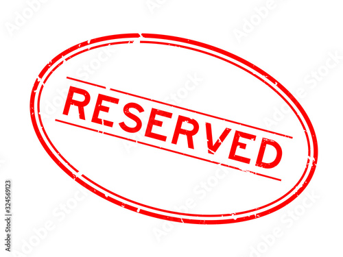 Grunge red reserved word oval rubber seal stamp on white background
