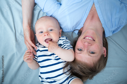 Cute baby with mother at home