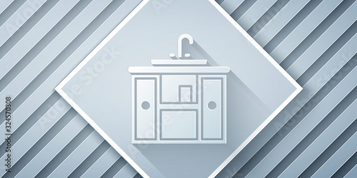 Paper cut Washbasin cabinet with water tap icon isolated on grey background. Paper art style. Vector Illustration