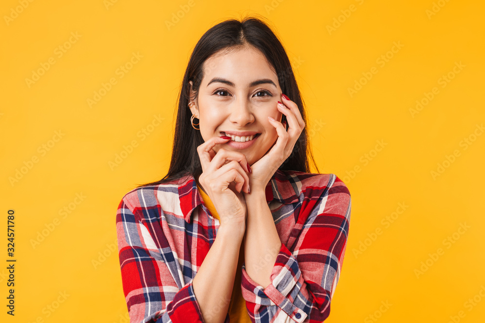 Photo of happy brunette woman smiling while looking at camera Photo of happy brunette woman smiling while looking at camera