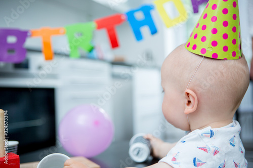 Cute child celebrating first birthday