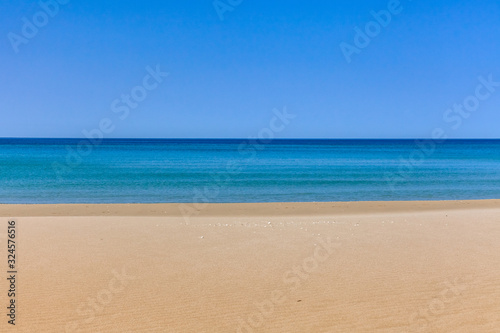 View of blue sea waves at sandy beach. Horizon line. Caspian Sea  sandstone coast. ustyurt. Selective focus  long shutter speed
