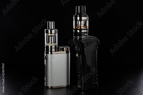 electronic cigarettes or vaping devices on black background