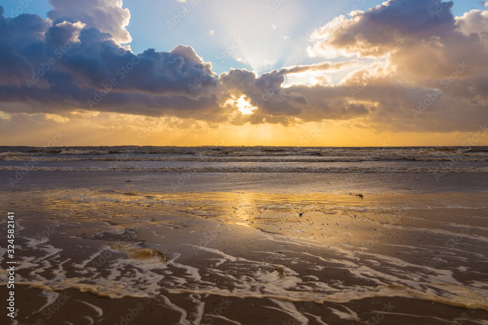 clouds and sunset at rockanje north sea beach clouds and sunset at rockanje north sea beach