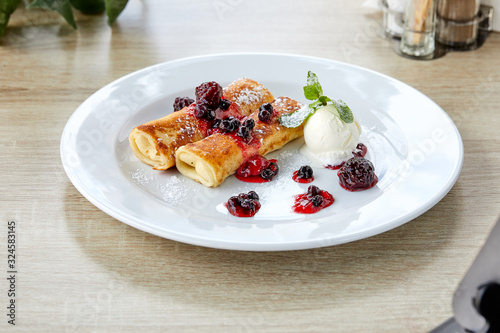 pancakes with berries and ice cream