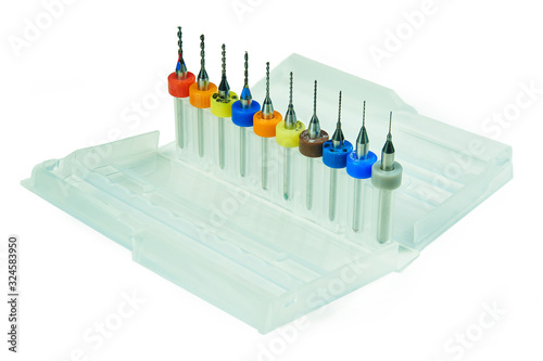 Set of small drills for small jobs in a plastic box isolated on a white background