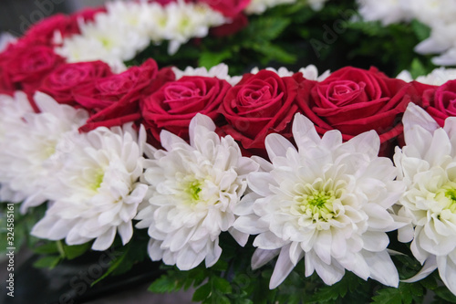 Roses and chrysanthemum  flowers arrangement  white and red roses  small cute flowers.