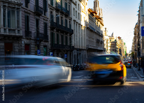 A taxi driving through the city.