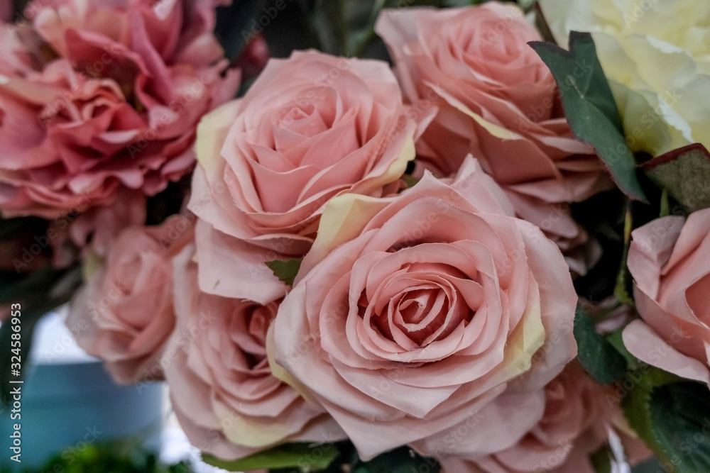 Artificial bouquet of flowers. Bouquet of mixed flowers. Floral shop, flower market. Concept of greeting, presents..