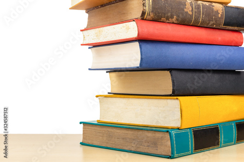 Stack of old books on shelf book on White background