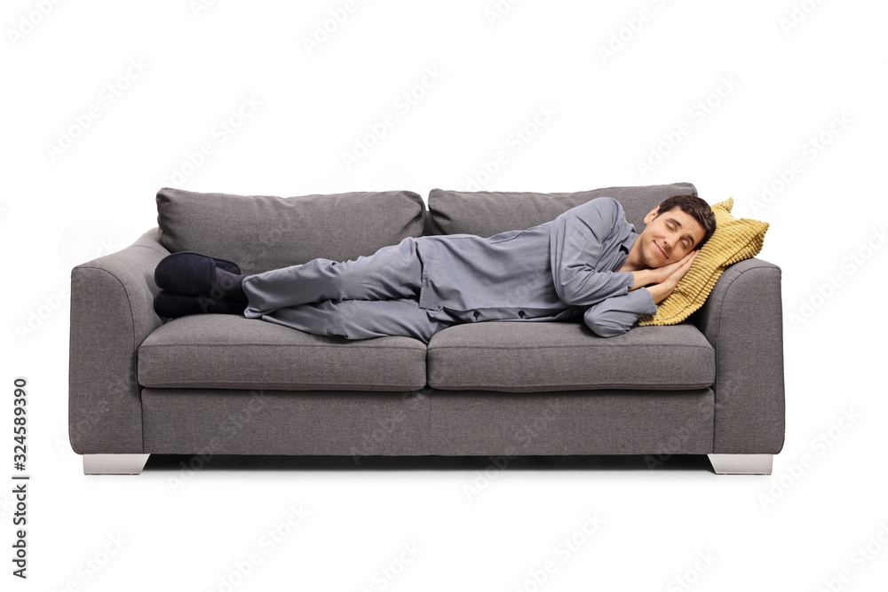 Man in pajamas sleeping on a sofa and dreaming a beautiful dream Man in pajamas sleeping on a sofa and dreaming a beautiful dream