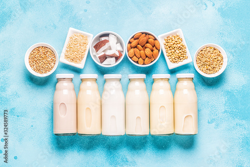 A bottles of alternative  milk and ingredients. photo