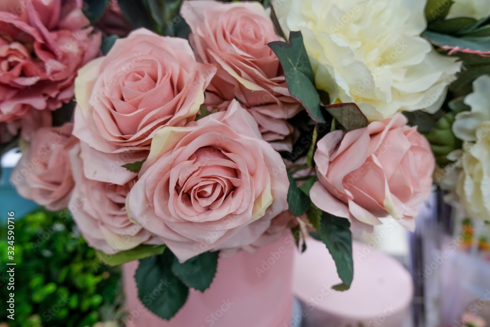 Artificial flower composition in floral shop. Floral theme, making bouquets.