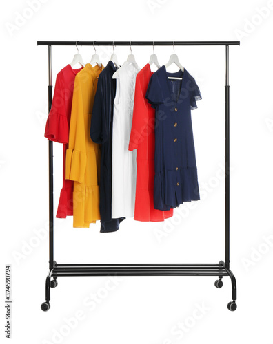 Rack with stylish women's clothes isolated on white