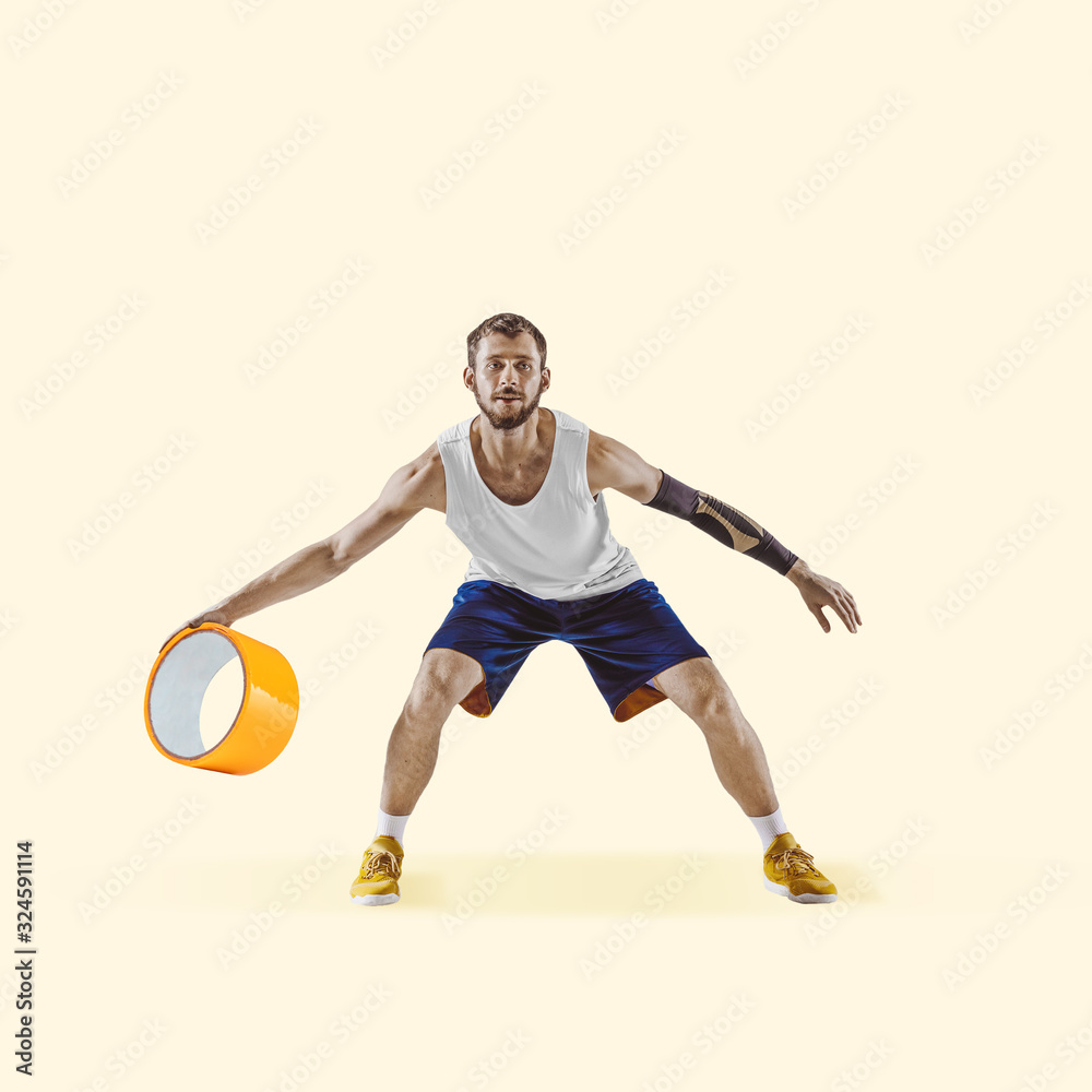 Basketball player with big duct tape on yellow background. Copyspace for your proposal. Modern design. Contemporary artwork, collage. Concept of sport, office, hard work, dreams, business, action.