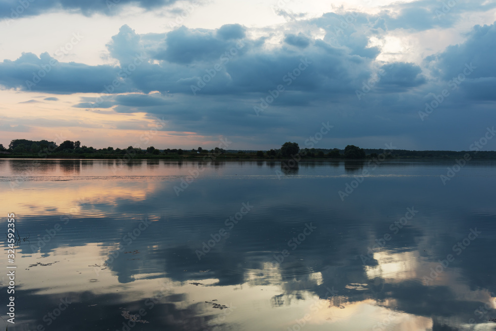 Beautiful summer landscape on the river, with beautiful evening sky.