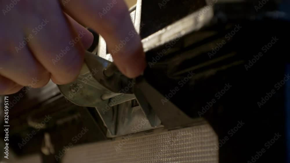 Extreme close-up of hands opening a metal latch on a box or crate and opening the lid. Extreme close-up of hands opening a metal latch on a box or crate and opening the lid.