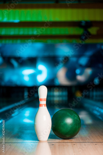 Canvas Print selective focus of bowling ball and skittle on bowling alley