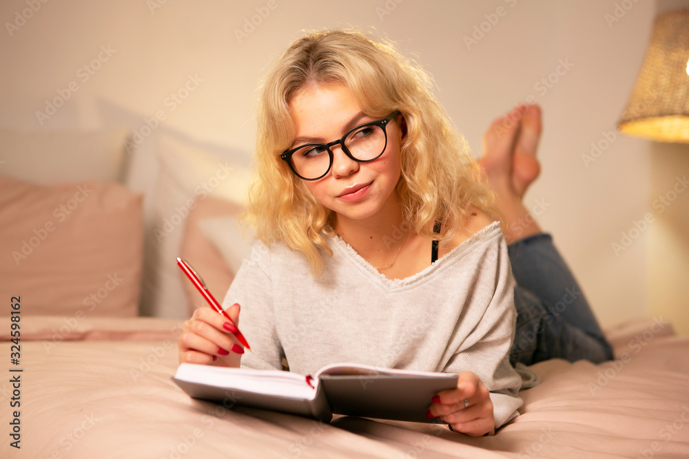 Young woman studying at night at home Young woman studying at night at home