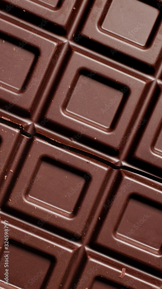 Dark chocolate pieces isolated on white background. Top view. Dark chocolate pieces isolated on white background. Top view.