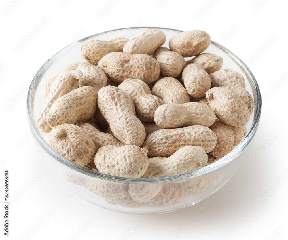 Raw peanuts in glass bowl isolated on white background with clipping path Raw peanuts in glass bowl isolated on white background with clipping path