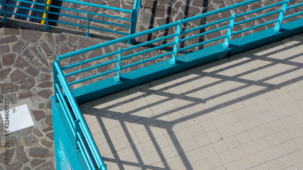 Fototapeta premium Blue railings and terraces at the seaside