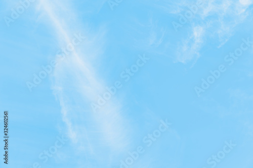 Beautiful blue sky with blurred cirrocumulus white clouds photo