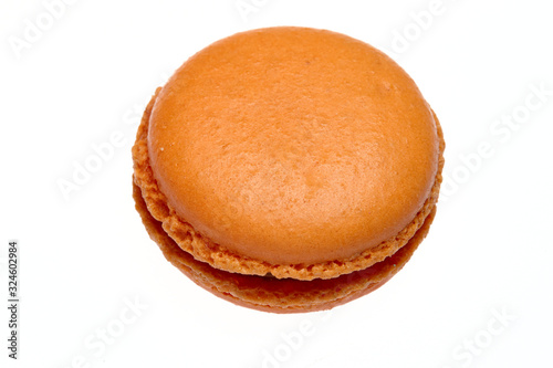 round baked almond flour macaron isolated on a white background, delicious popular french dessert