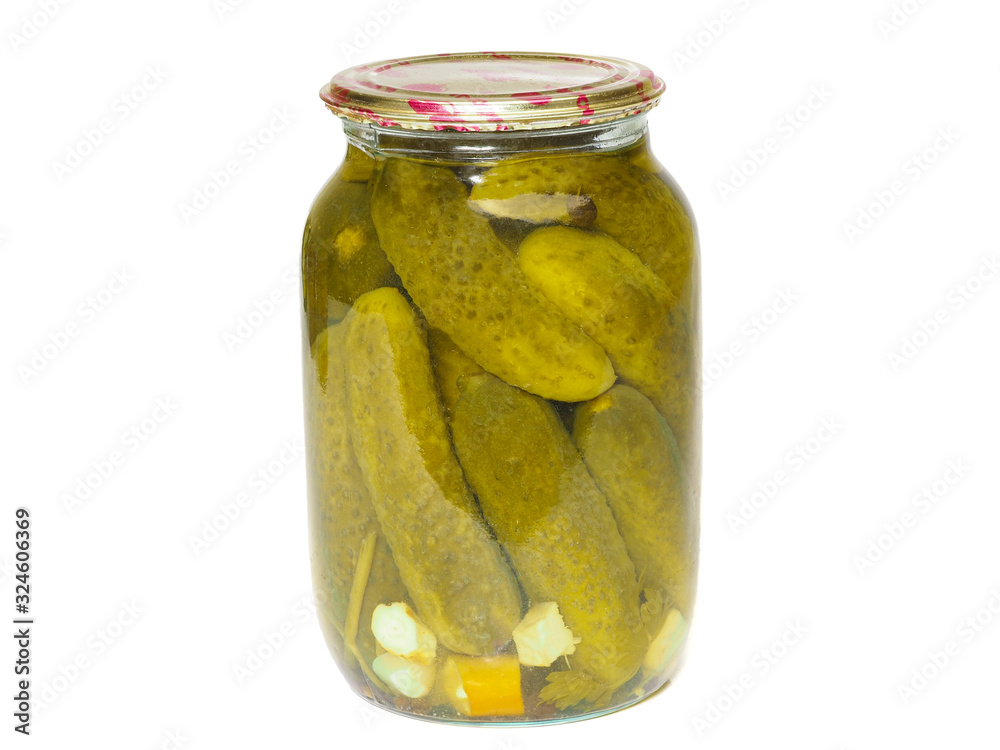 Glass jar with homemade canned pickled cucumbers on a white background Glass jar with homemade canned pickled cucumbers on a white background