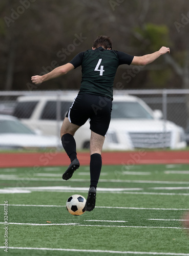 Boy Soccer Players making exciting plays during a soccer game
