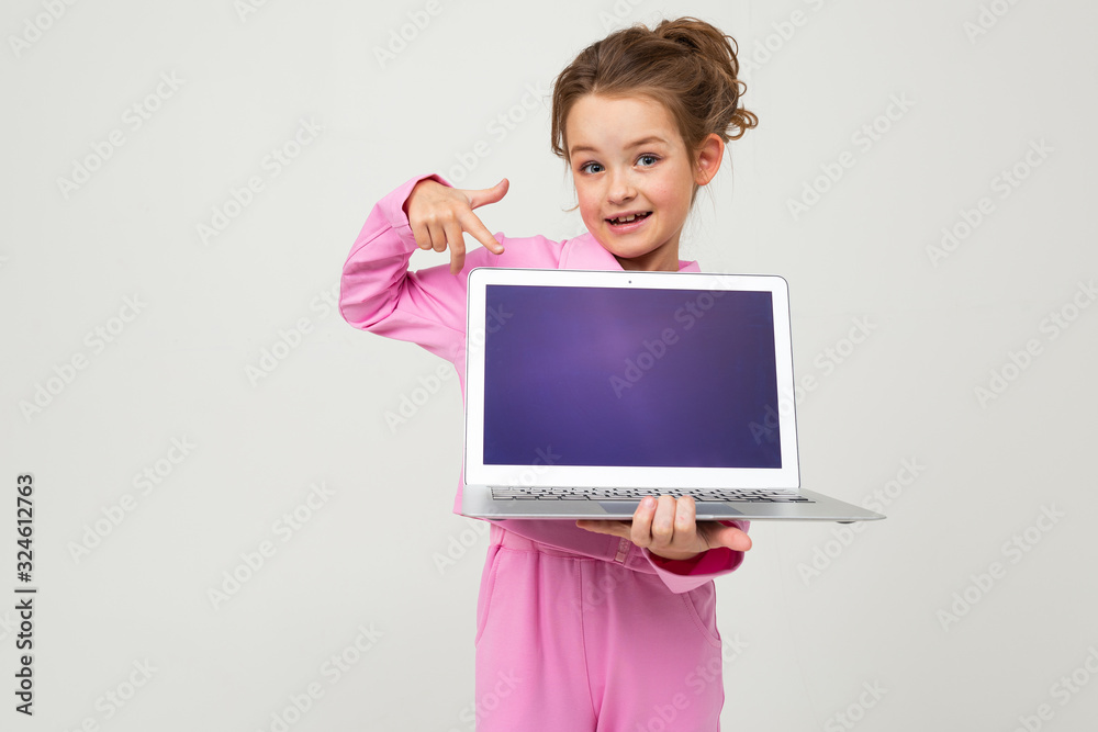 contented caucasian girl holding a laptop with the screen forward with the layout for the page on a white background
