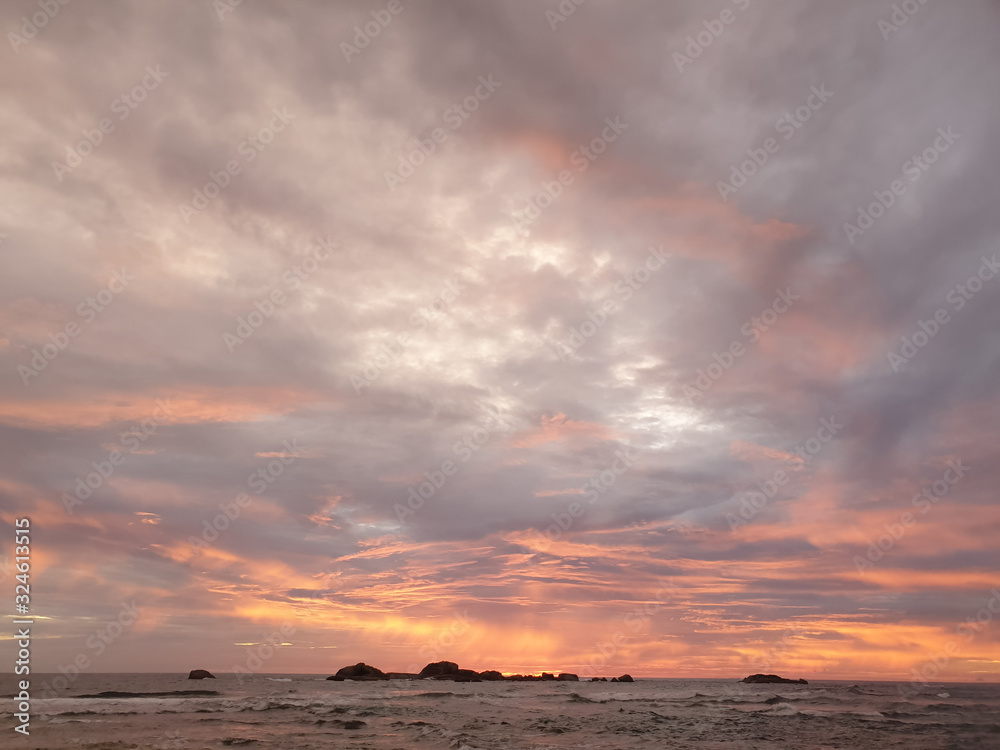 Beautiful landscape of calm ocean waves and sunset sky Beautiful landscape of calm ocean waves and sunset sky