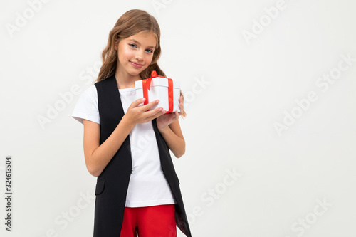 Pretty little girl in costume stands with gift isolated on white background © Ivan Traimak