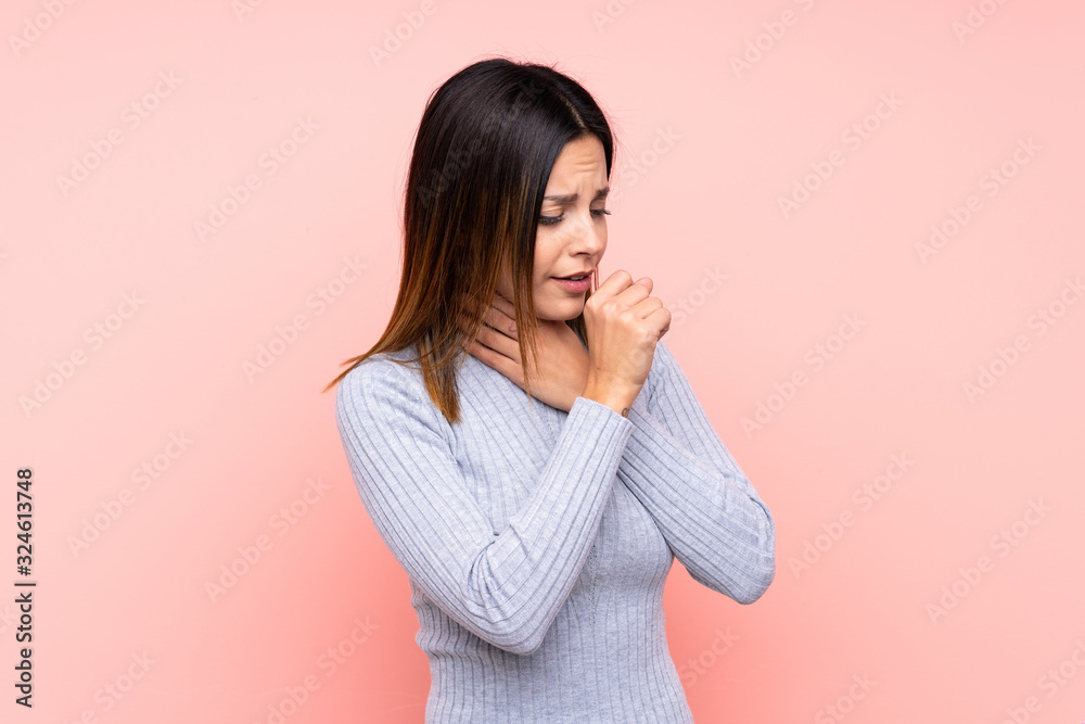 Woman over isolated pink background is suffering with cough and feeling bad Woman over isolated pink background is suffering with cough and feeling bad