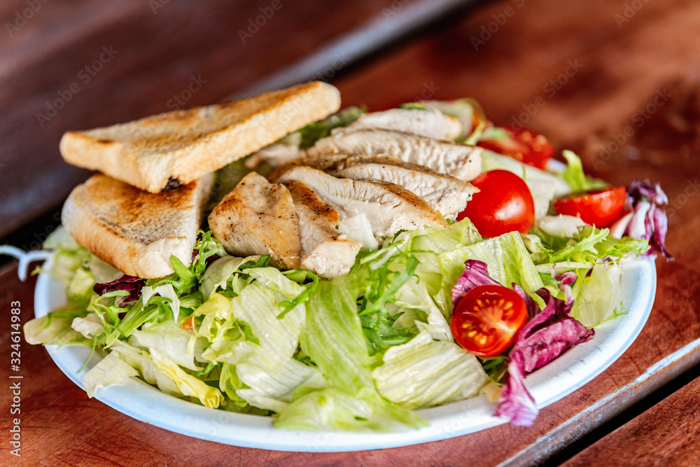 Fresh garden salad. Fresh garden salad on a plate. Fresh and healthy vegetable salad with meat Fresh garden salad. Fresh garden salad on a plate. Fresh and healthy vegetable salad with meat