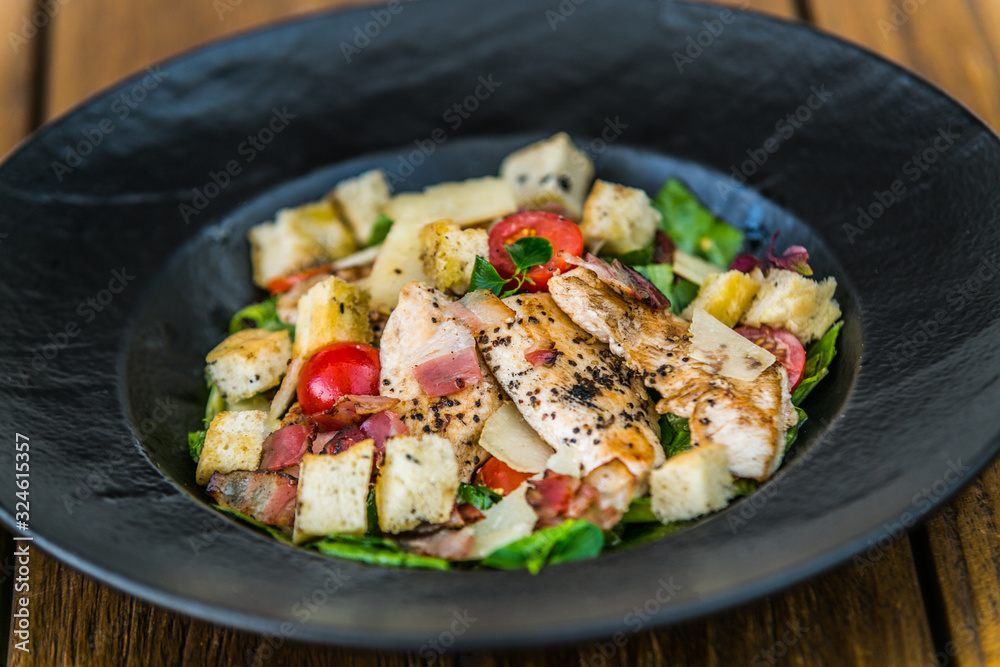 Fresh garden salad. Fresh garden salad on a plate. Fresh and healthy vegetable salad with meat Fresh garden salad. Fresh garden salad on a plate. Fresh and healthy vegetable salad with meat